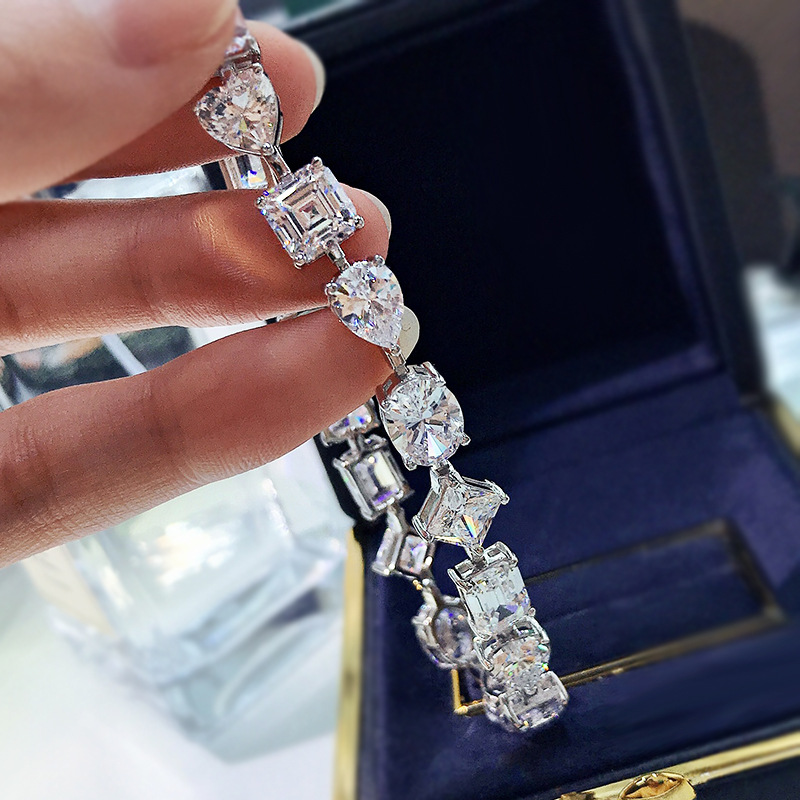 Celeste mixed-cut moissanite bracelet detail with heart and emerald cut stones