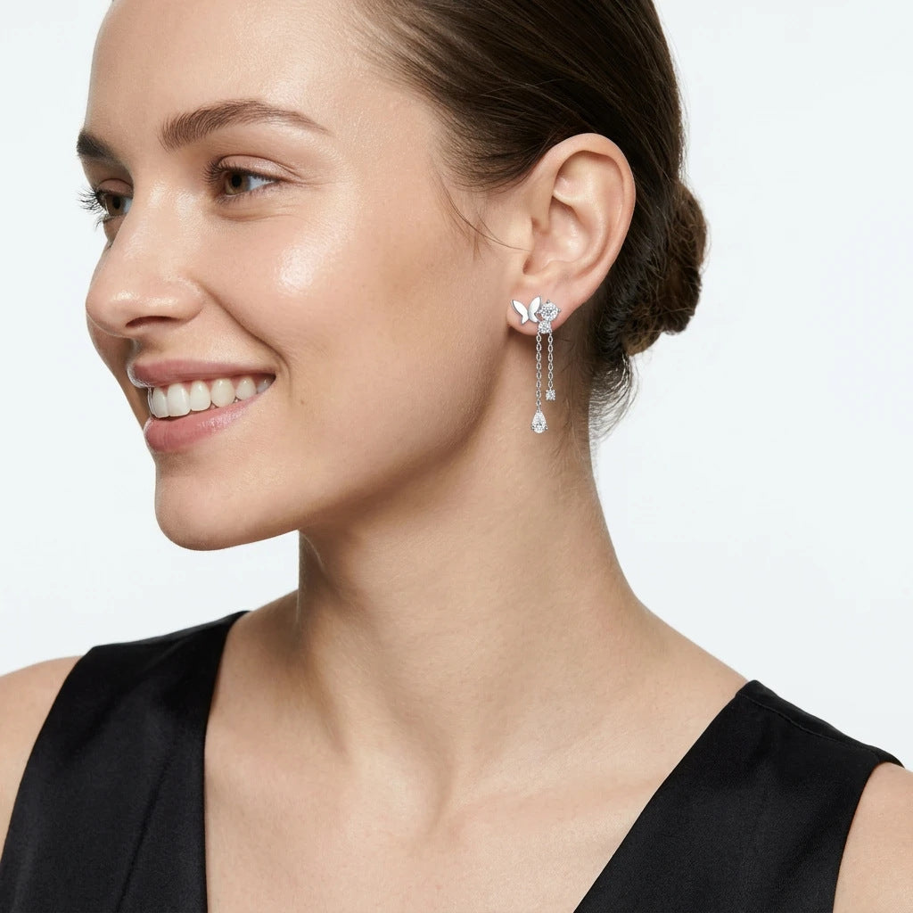 VANLARA butterfly tassel moissanite earrings worn on ear side view